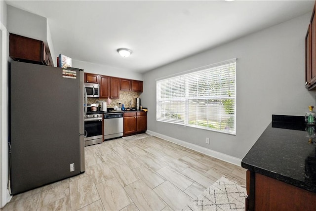 6980 Roswell Rd # A8, Atlanta, GA 30328 - kitchen with stainless steel appliances, baseboards, and tasteful backsplash