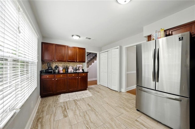 6980 Roswell Rd # A8, Atlanta, GA 30328 - kitchen featuring freestanding refrigerator, tasteful backsplash, dark countertops, and baseboards