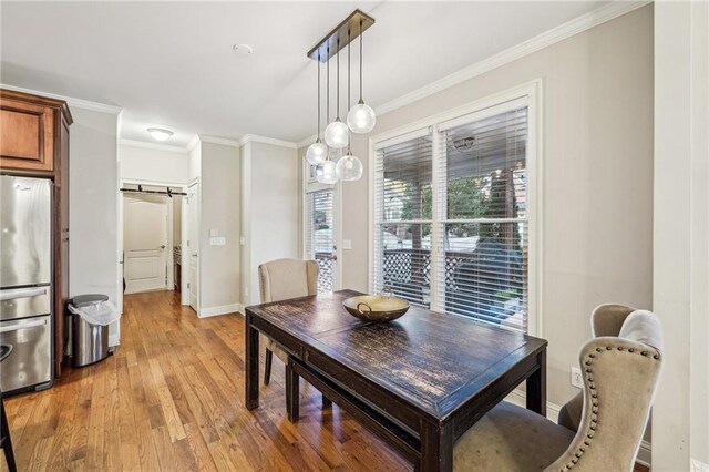 carpeted bedroom featuring ceiling fan and crown molding