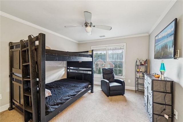 bedroom with carpet, ceiling fan, and crown molding