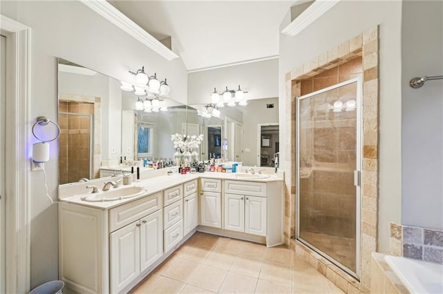 bathroom with tile patterned floors, separate shower and tub, crown molding, vaulted ceiling, and vanity