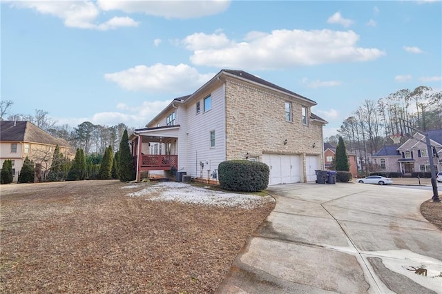 view of side of property with a garage