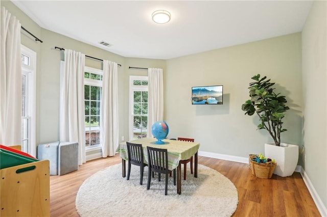 recreation room featuring wood finished floors and baseboards