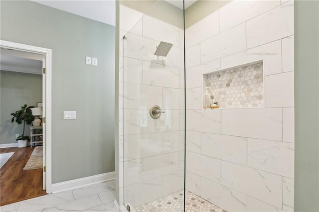 full bathroom with walk in shower and baseboards