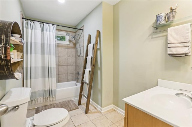 bathroom featuring toilet, tile patterned flooring, shower / bath combination with curtain, baseboards, and vanity