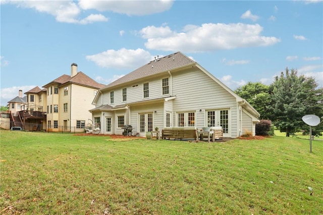 rear view of house with french doors and a patio