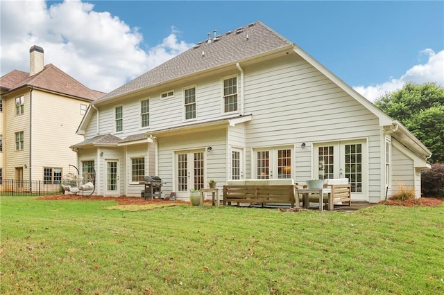 rear view of property with french doors