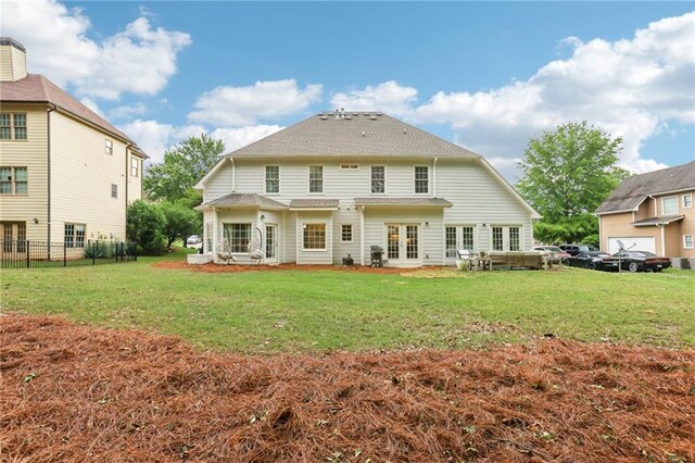 back of property featuring french doors