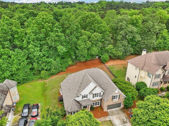 view from above of property featuring a forest
