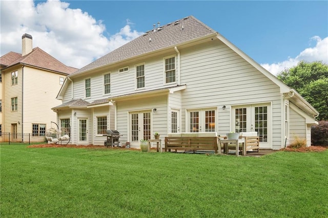 rear view of house featuring french doors