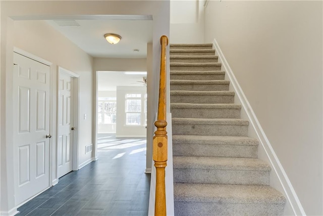 stairway with ceiling fan