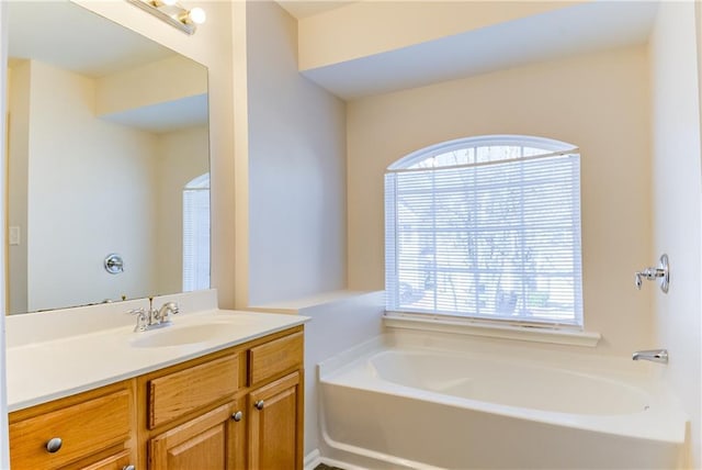 bathroom with a bathtub and vanity