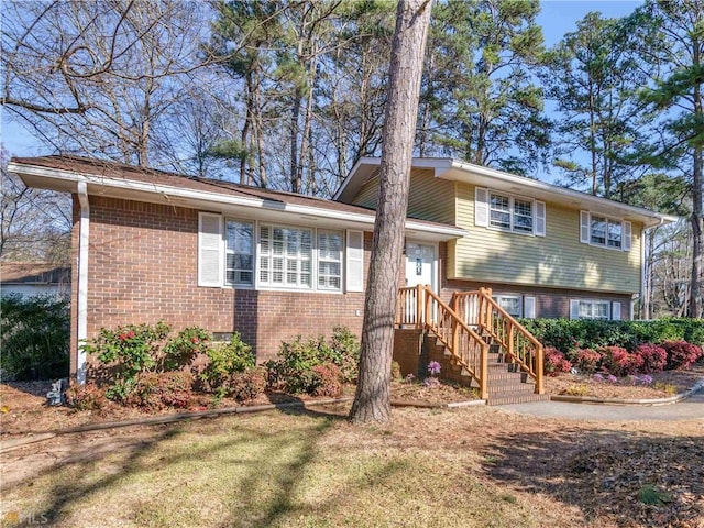 split level home with a front yard