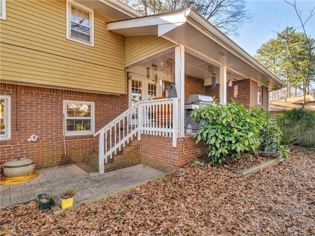 property entrance featuring a patio