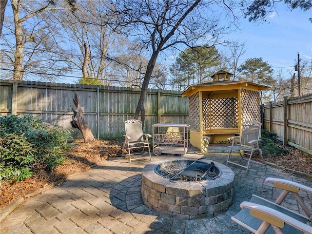 view of patio / terrace featuring a gazebo and an outdoor fire pit