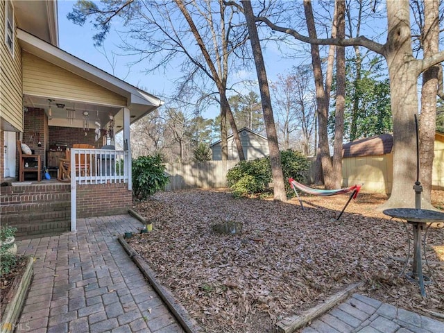 view of yard featuring covered porch