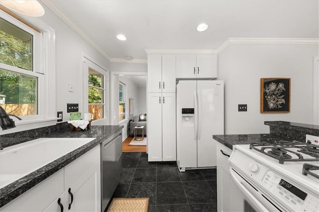 2272 Desmond Dr, Decatur, GA 30033 - kitchen with white appliances, ornamental molding, a sink, white cabinets, and dark stone counters