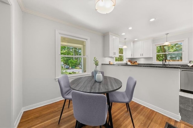2272 Desmond Dr, Decatur, GA 30033 - dining space featuring plenty of natural light, crown molding, light wood-type flooring, baseboards, and recessed lighting