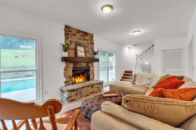 living area featuring wood finished floors and a fireplace