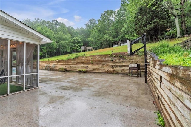 view of patio / terrace with a sunroom