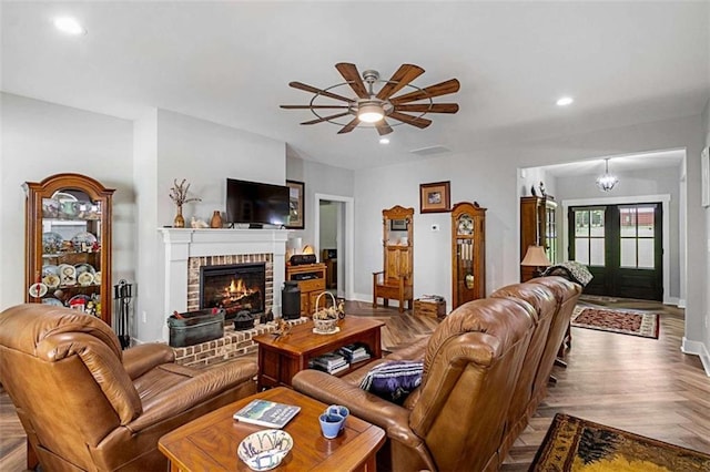 1505 Willis Rd, Barnesville, GA 30204 - living room with a brick fireplace, ceiling fan, and recessed lighting