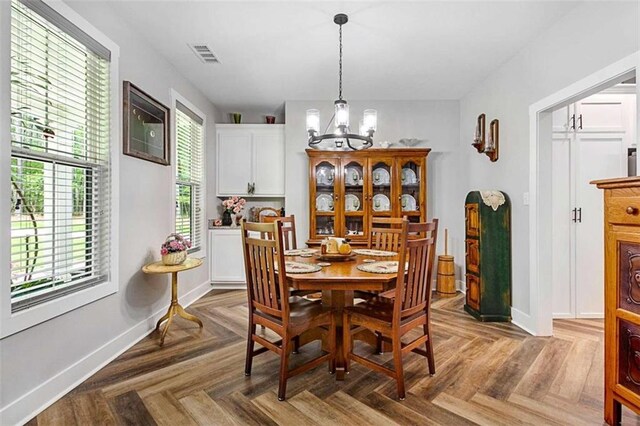 1505 Willis Rd, Barnesville, GA 30204 - dining room with a chandelier and baseboards