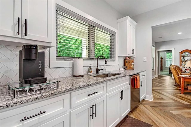 1505 Willis Rd, Barnesville, GA 30204 - kitchen featuring dishwasher, white cabinets, decorative backsplash, light stone countertops, and recessed lighting