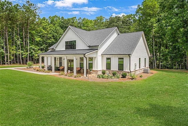 1505 Willis Rd, Barnesville, GA 30204 - modern farmhouse with roof with shingles, a standing seam roof, a front yard, and board and batten siding