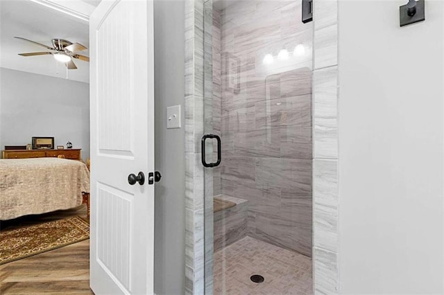 1505 Willis Rd, Barnesville, GA 30204 - ensuite bathroom with a shower stall, a ceiling fan, and wood finished floors