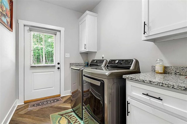 1505 Willis Rd, Barnesville, GA 30204 - laundry area with washing machine and dryer, cabinet space, and wood finished floors