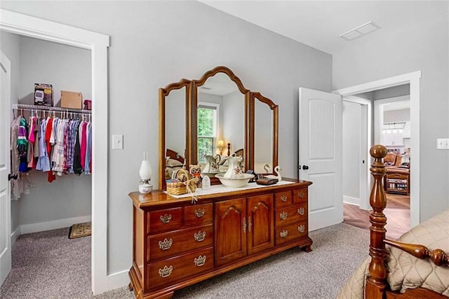 1505 Willis Rd, Barnesville, GA 30204 - carpeted bedroom featuring a walk in closet and a closet