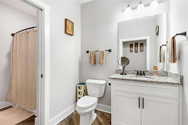 1505 Willis Rd, Barnesville, GA 30204 - bathroom with wood finished floors, vanity, and a shower with shower curtain