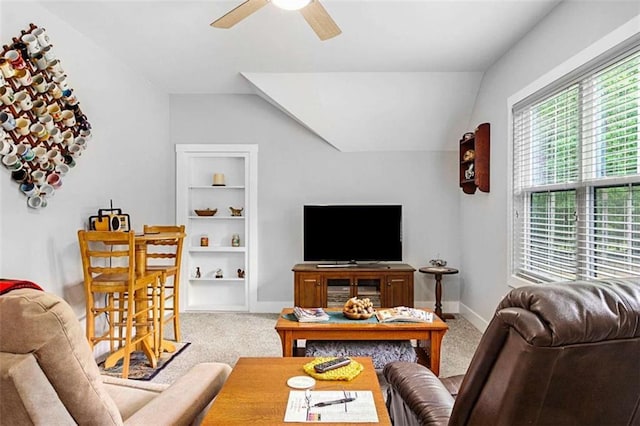1505 Willis Rd, Barnesville, GA 30204 - living area featuring vaulted ceiling, ceiling fan, carpet, and built in shelves