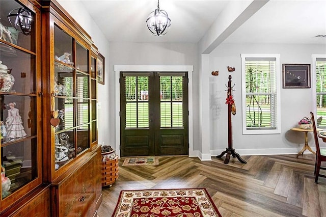 1505 Willis Rd, Barnesville, GA 30204 - entrance foyer with french doors, healthy amount of natural light, and a chandelier