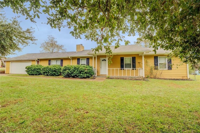 single story home featuring a garage, covered porch, and a front lawn