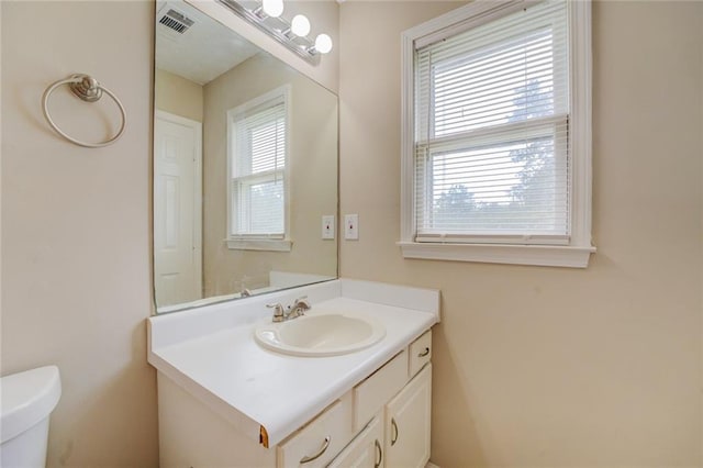 bathroom with vanity and toilet