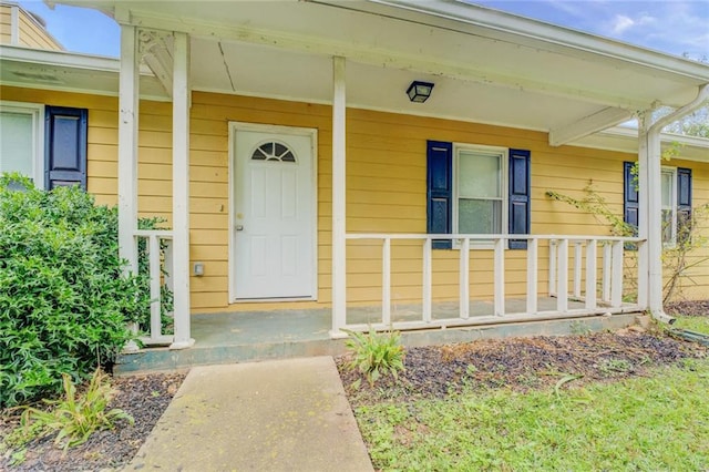 property entrance featuring covered porch