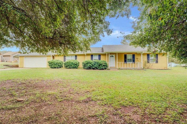 1187 Dixie Rd, Covington, GA 30014 - ranch-style home featuring covered porch, a front yard, and an attached garage