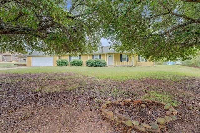 1187 Dixie Rd, Covington, GA 30014 - view of front facade with a porch, a front lawn, and an attached garage