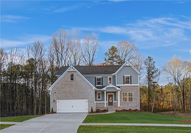 view of front of home featuring a garage and a front yard