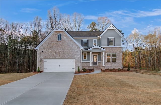 view of front of home with a garage and a front yard