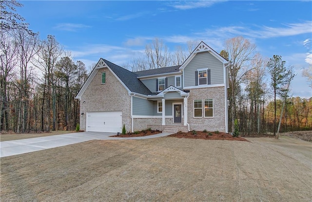 front of property featuring a garage and a front yard