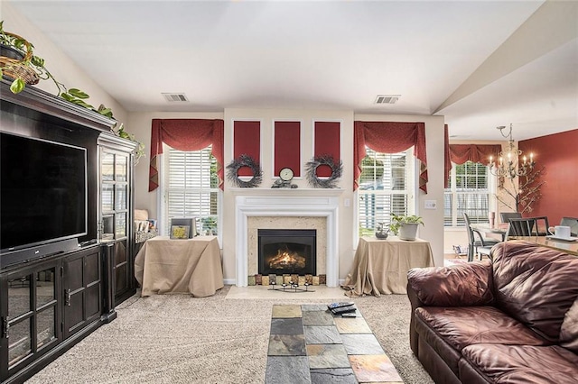3198 Liberty Commons Dr, Kennesaw, GA 30144 - carpeted living room featuring a chandelier and a fireplace with flush hearth