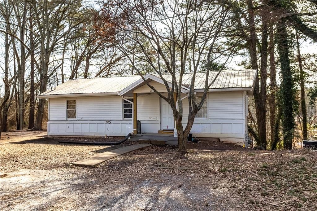 ranch-style house with metal roof