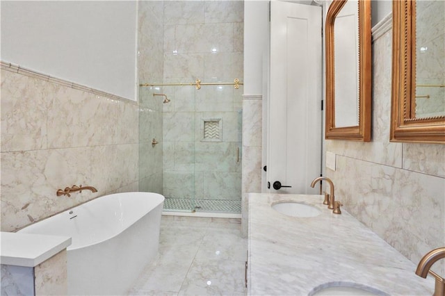 bathroom featuring vanity, plus walk in shower, and tile walls