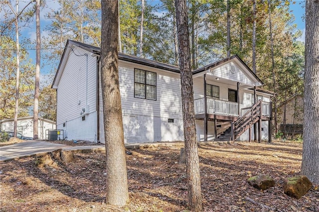 exterior space with stairs, crawl space, and central air condition unit