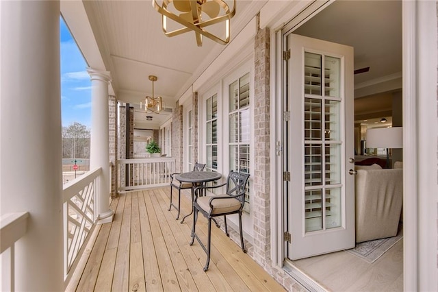 wooden terrace featuring covered porch