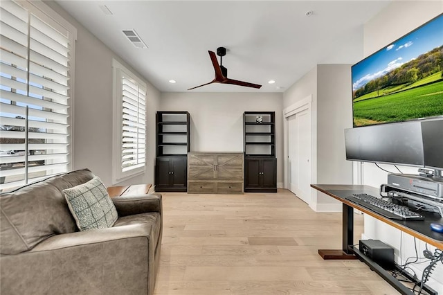 office area with ceiling fan and light hardwood / wood-style flooring