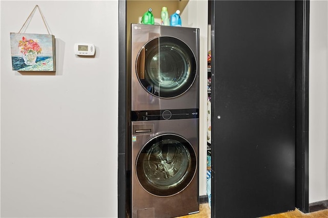 washroom with stacked washer / drying machine