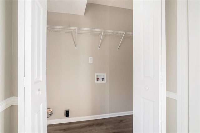 laundry area featuring washer hookup and dark hardwood / wood-style floors